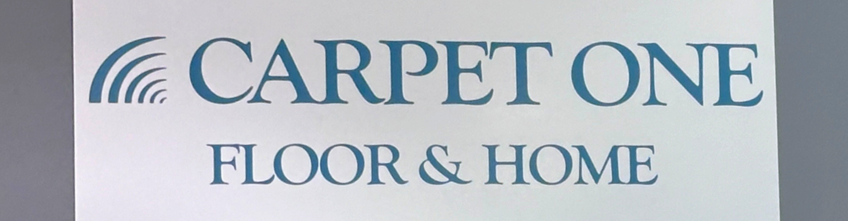 carpet one floor & home logo on store showroom wall