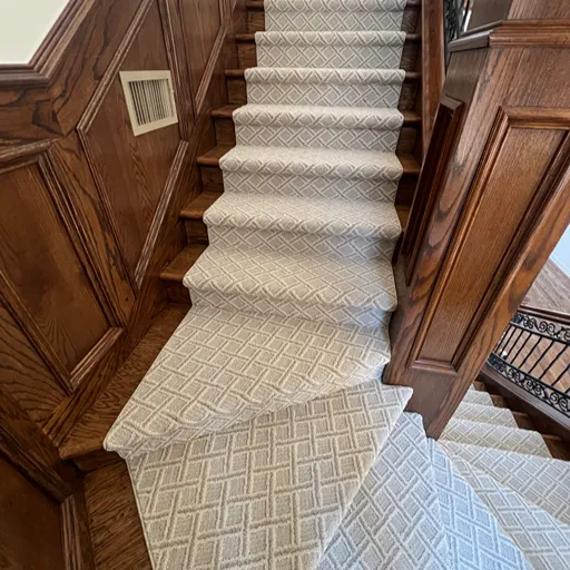 Patterned carpet, hardwood staircase, wood wainscotting, Texas